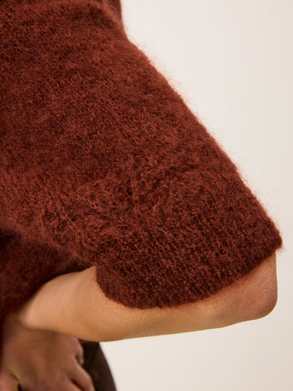 Close-up of the sleeves on the Olivia mohair sweater in carmin red