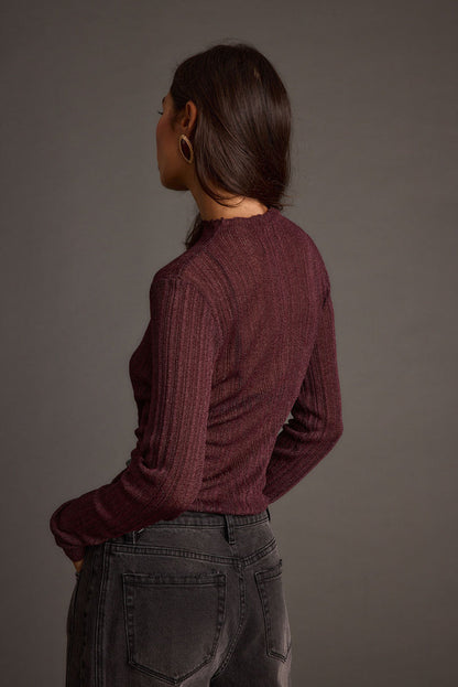 Full-length view of the top showing the drape and movement.