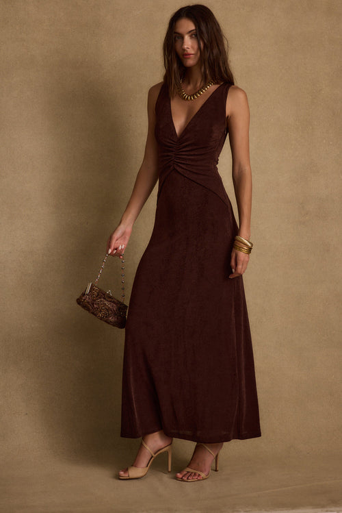 Espresso maxi dress with elegant accents, a vacation maxi dress essential.