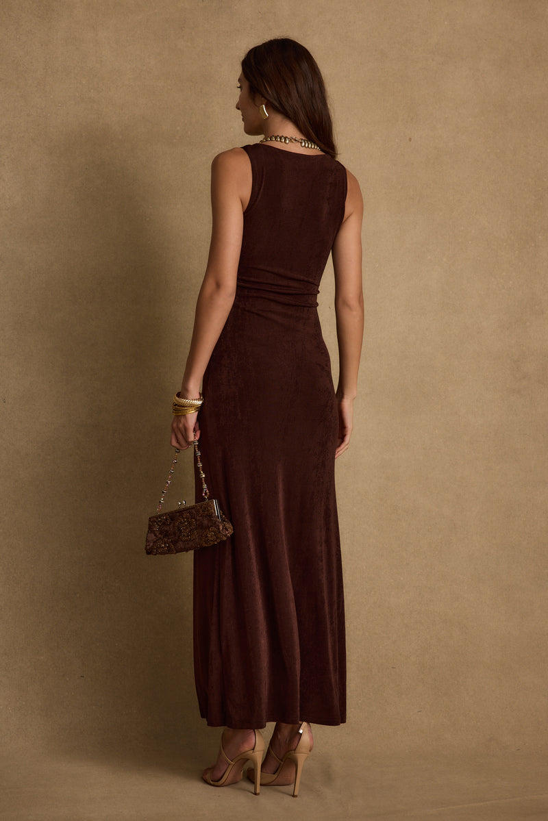 Full-length view of the espresso maxi dress showing the drape and movement.