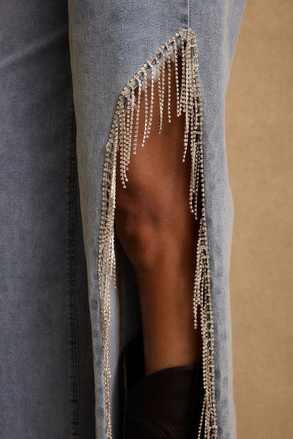 Full-length view of the jeans showing the drape and movement.