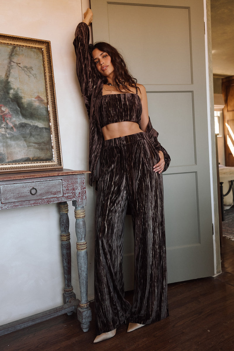 Rhea Espresso Velvet Trousers styled in a complete look from an alternate angle.