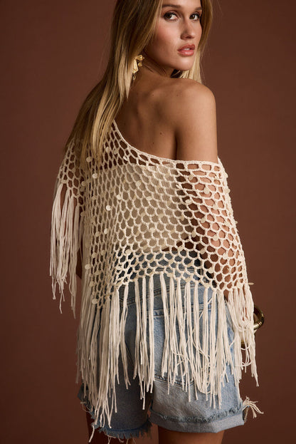 Back view of the ivory sequin and crochet piece showing the silhouette and fit.