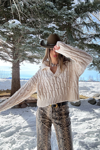 Riverstone Cream Cableknit Sweater styled in a complete look from an alternate angle.