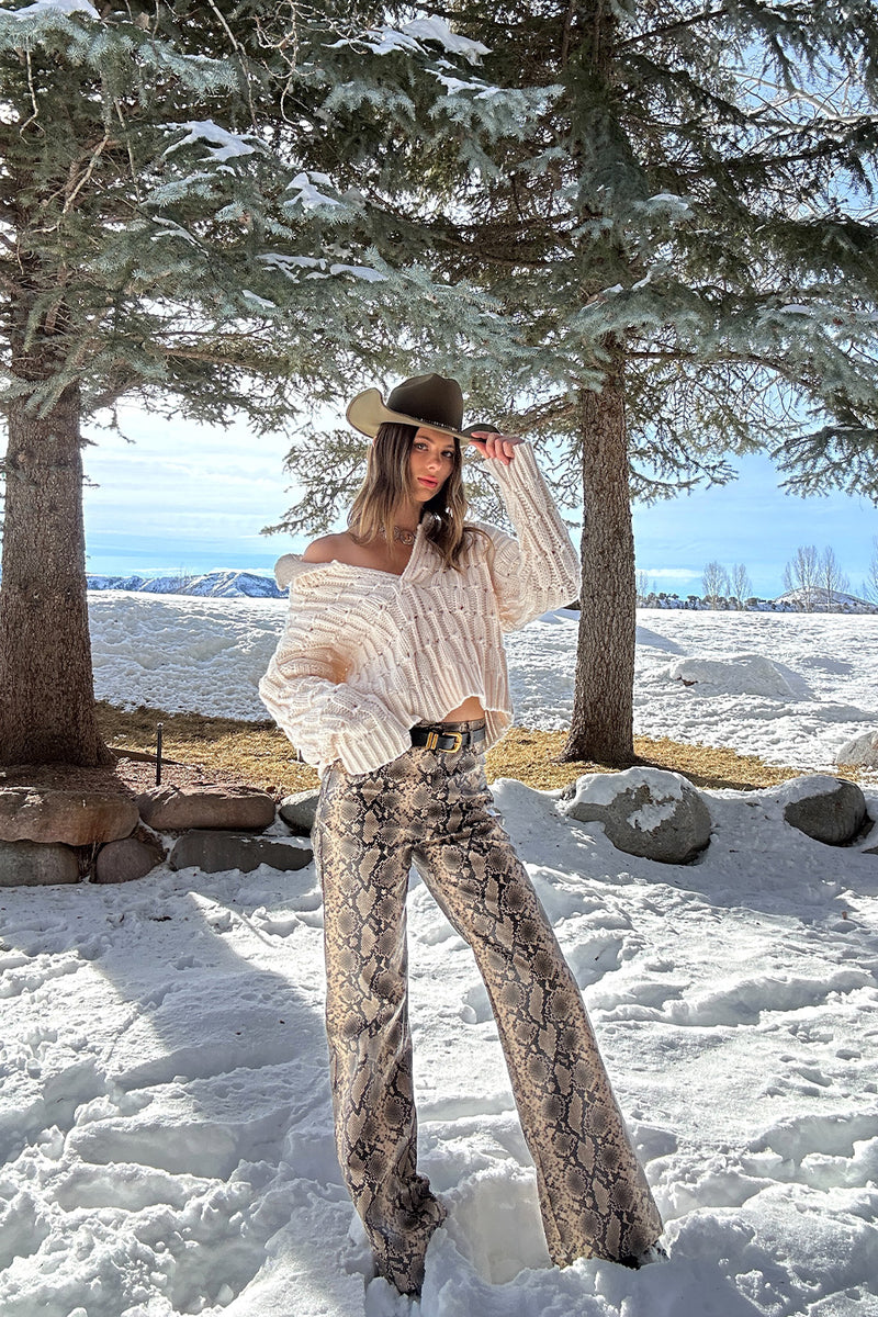 Riverstone Cream Cableknit Sweater paired with complementary accessories for a polished look.