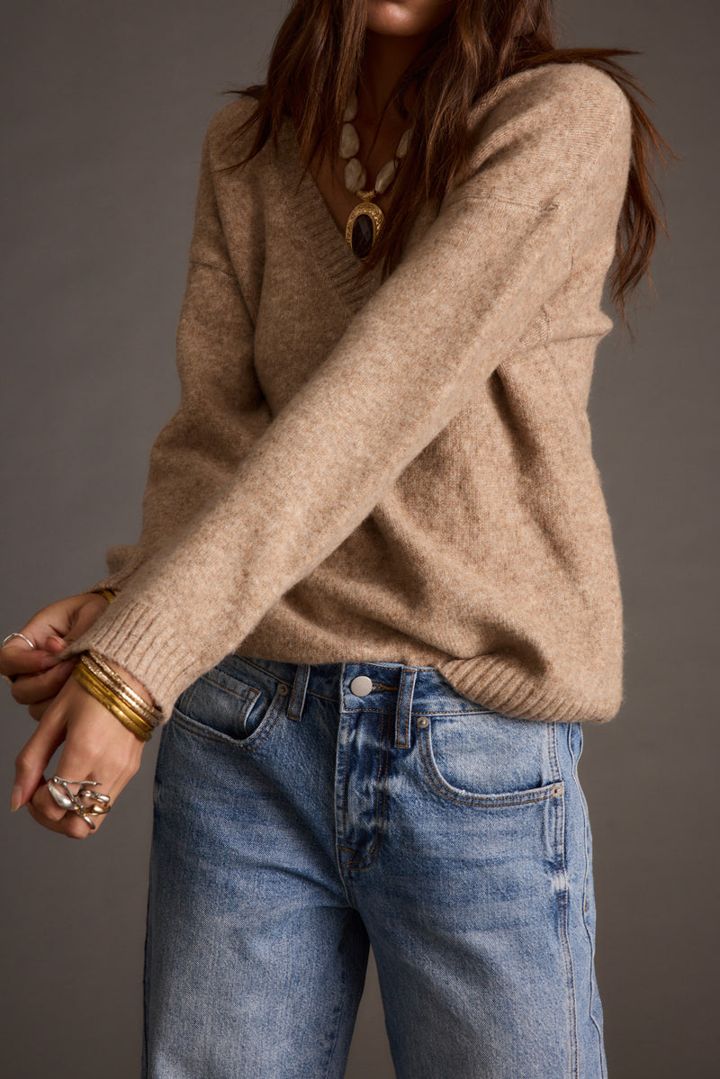Back view of the sweater showing the silhouette and fit.