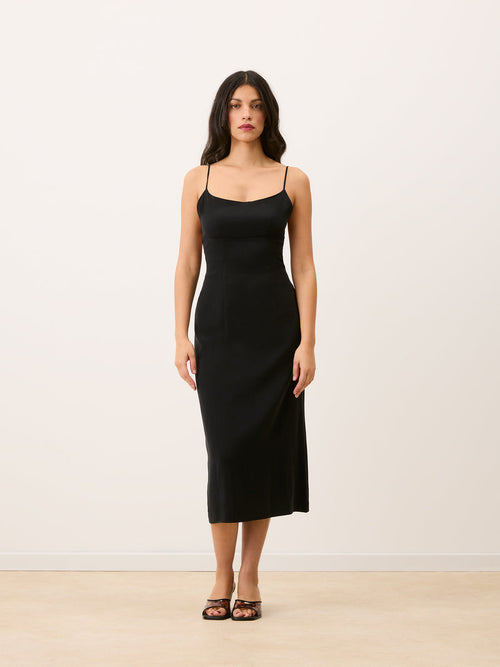 ANNICK black spaghetti strap midi dress worn on a model by Rouje