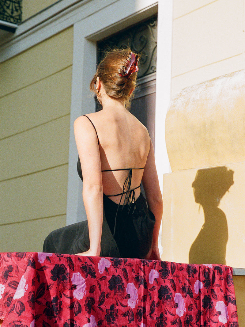 ANNICK black spaghetti strap midi dress, lifestyle setting by Rouje