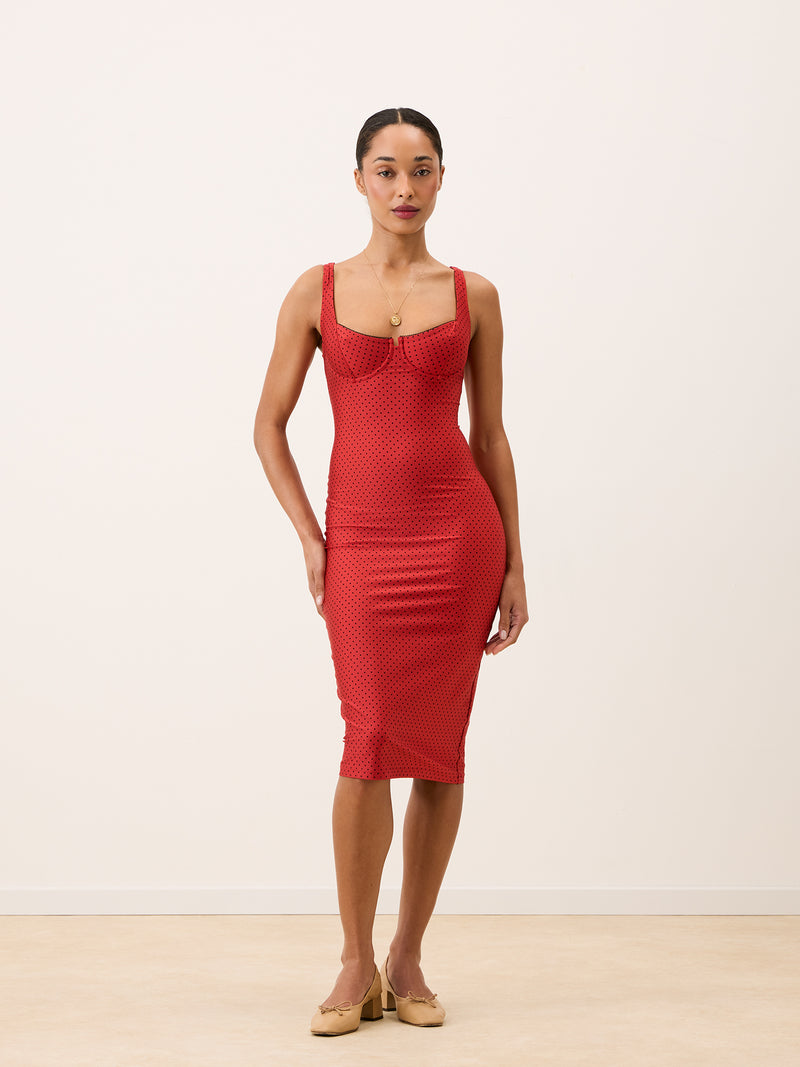 ARIELLE red plumetis midi dress worn on a model by Rouje
