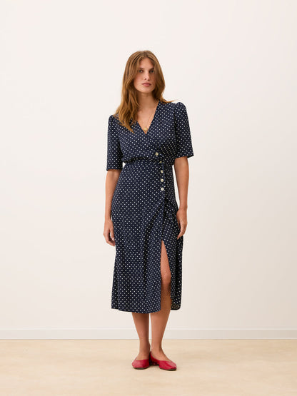 GABIN navy blue polka dot midi wrap dress worn on a model by Rouje