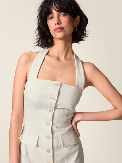 Front button and pocket detail on the white Griselda dress.