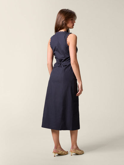 Back view of the back Lisbet dress tied at the waist with openwork details.