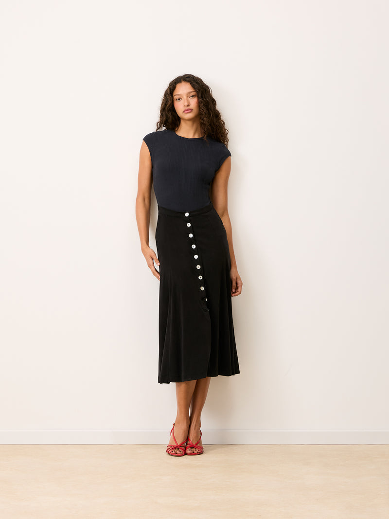 MAMBO dark blue Storm pointelle and cupro midi dress, lifestyle setting by Rouje