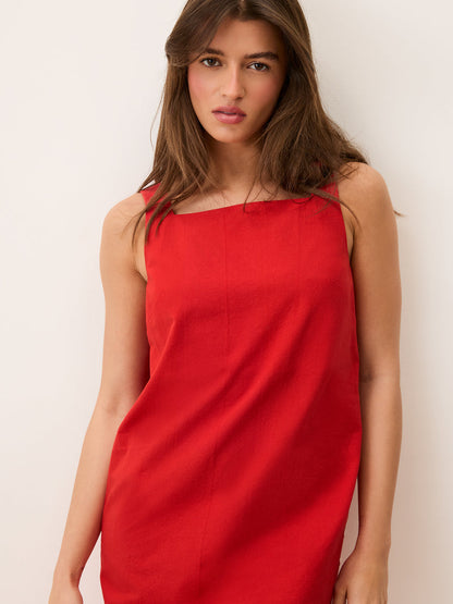 MARLA red short sleeveless dress worn on a model, full-length view by Rouje