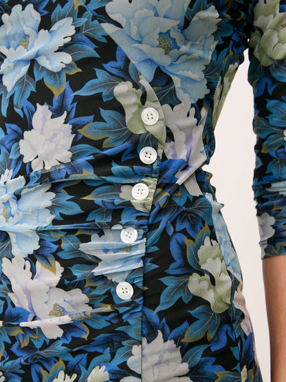 MONIRA blue floral print short faux wrap dress, lifestyle setting by Rouje
