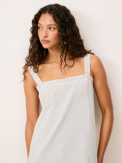 Rachel white short cotton voile strap dress worn by a model, cropped front view