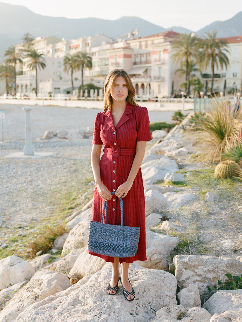RAELLA carmine red seersucker midi dress, lifestyle setting by Rouje
