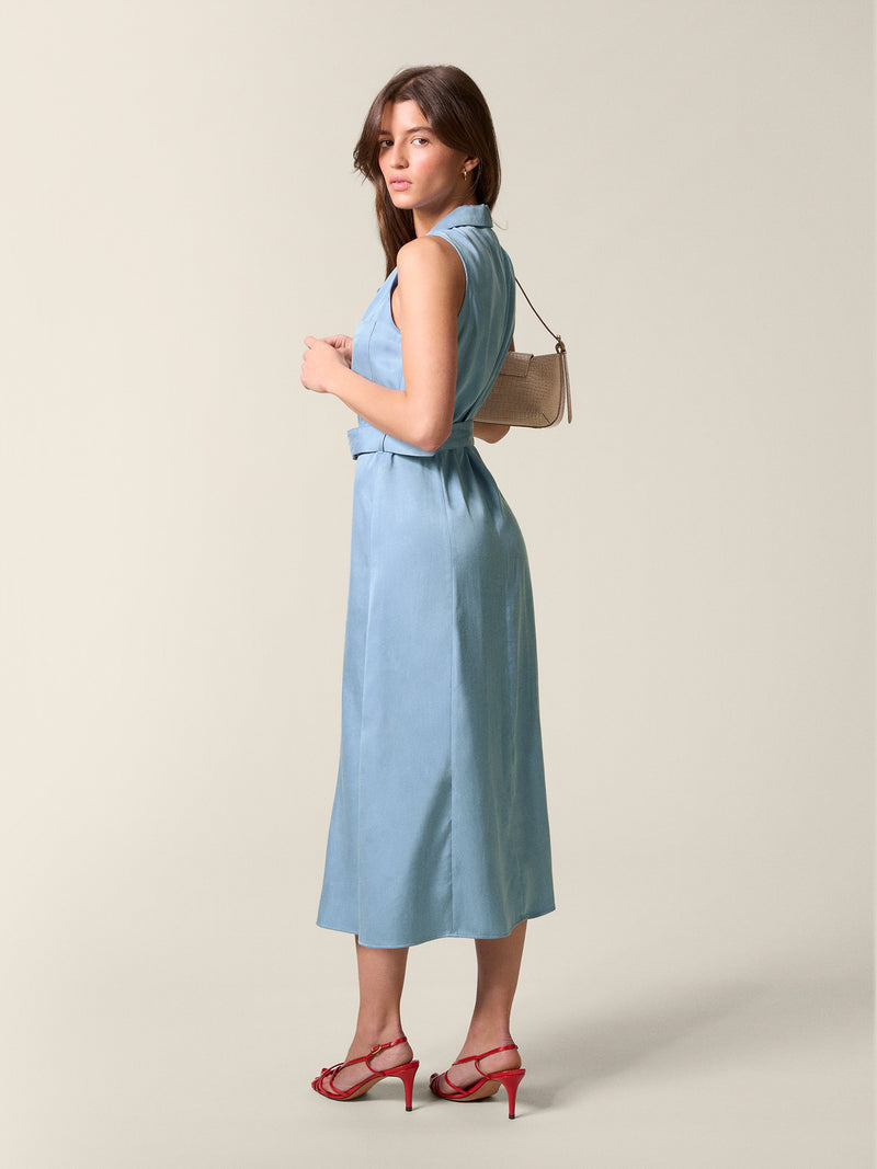 Full-back view of the blue Raquel dress, belted at the waist.