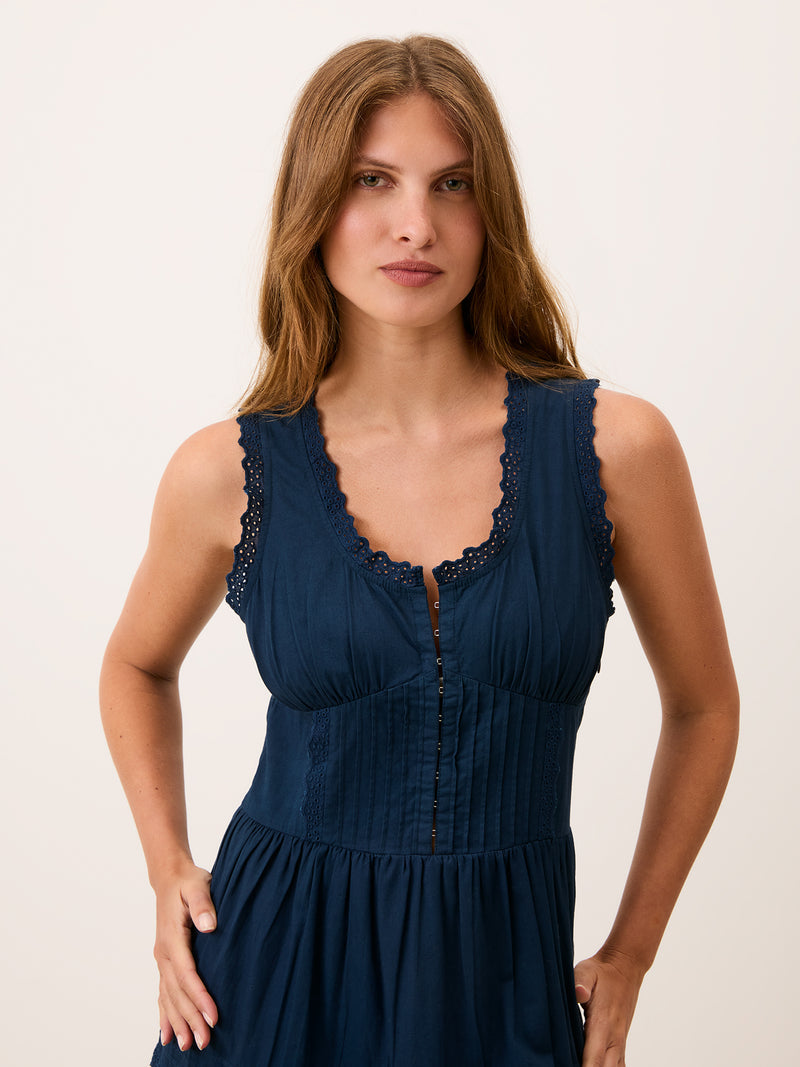 ROSELENE indigo blue corset midi dress worn on a model by Rouje
