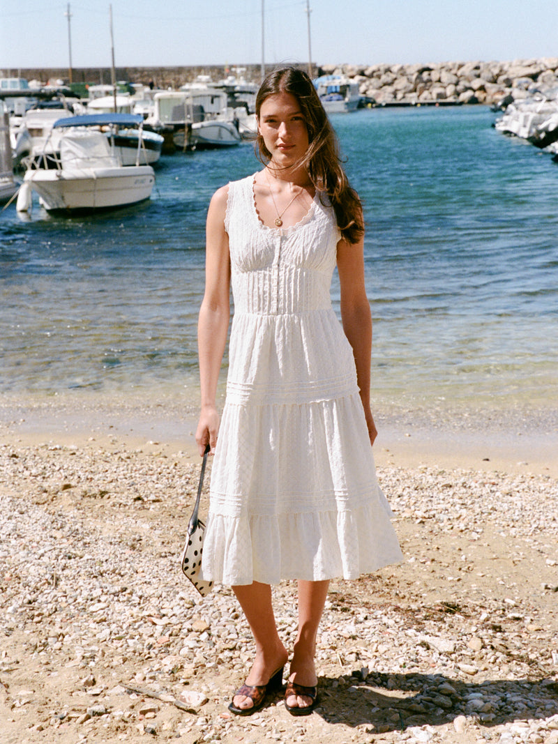 Roselene white maxi dress worn by a model, lifestyle setting