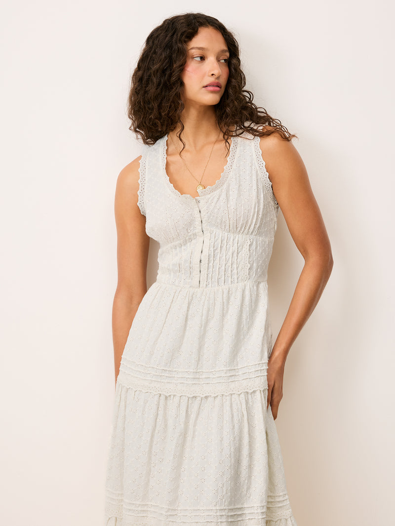 Front view cropped at the waist of the Roselene white maxi dress worn by a model