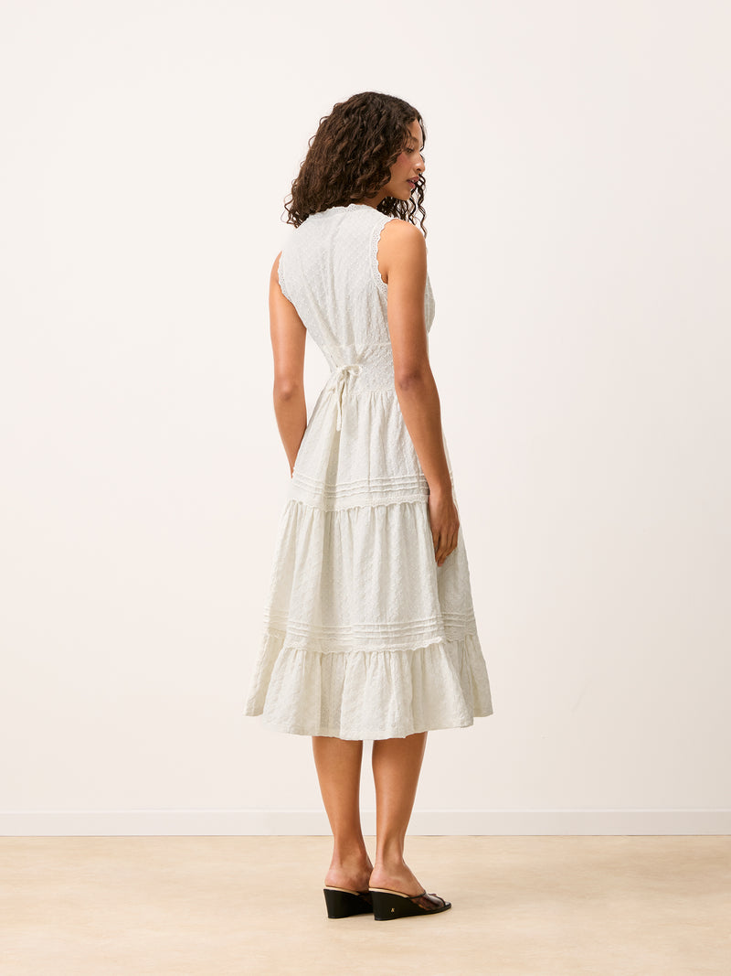 Full-length back view of the Roselene white maxi dress worn by a model