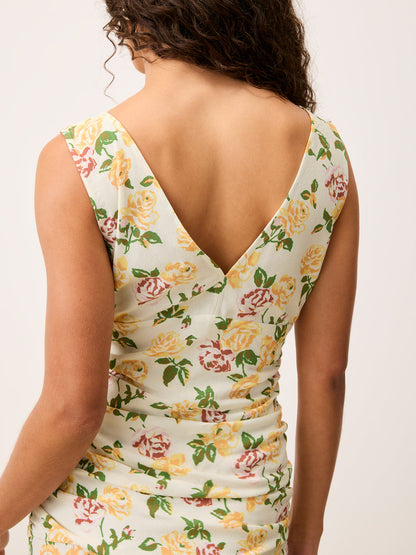Rear view of the Val floral maxi dress worn by a model