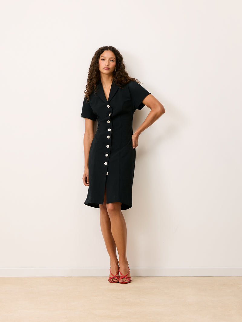 VICTOIRE black cotton midi dress worn on a model, full-length view by Rouje