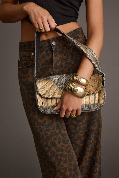 Runyon Set of 2 Gold Cuff Bangles styled in a complete look from an alternate angle.