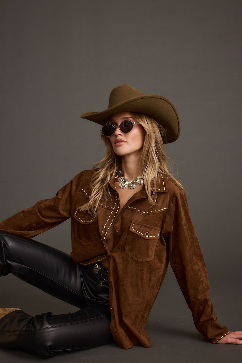 Brown top with elegant accents, a brown corset top essential.