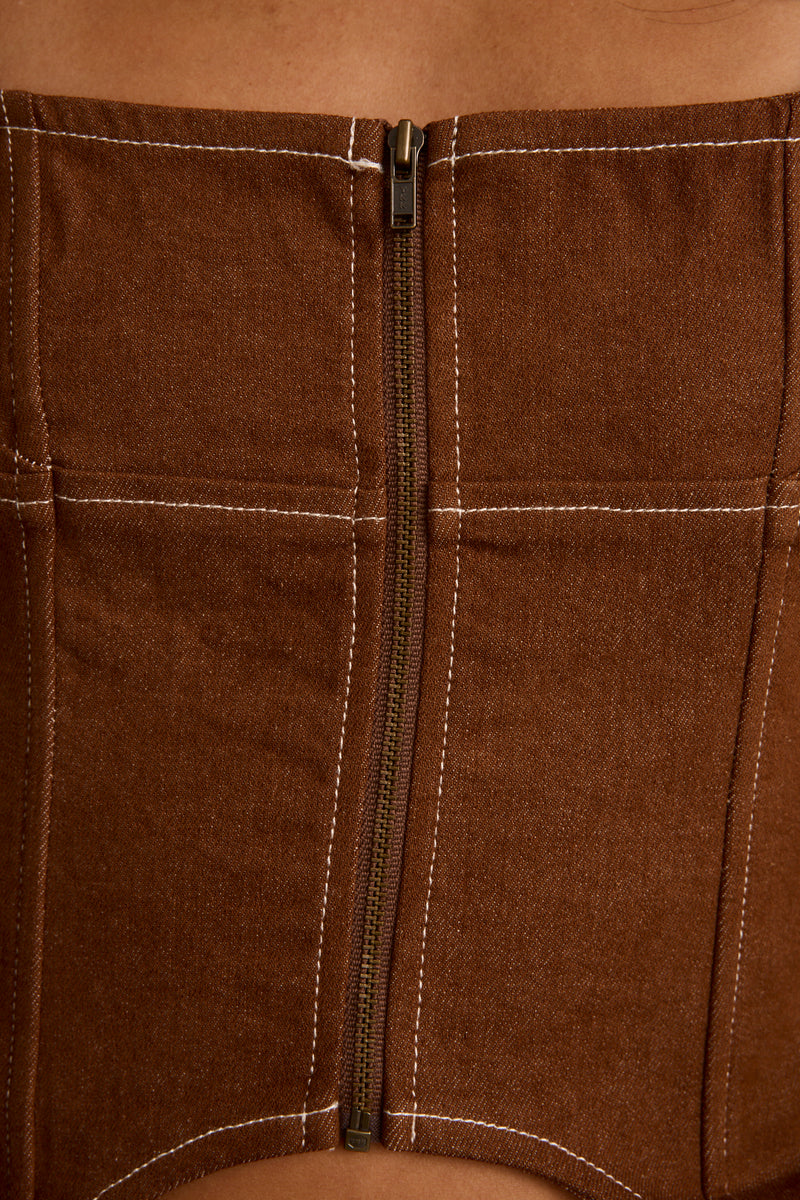 Lifestyle shot of the brown piece styled for day-to-night versatility.