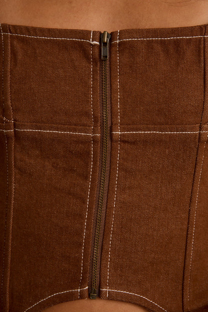 Lifestyle shot of the brown piece styled for day-to-night versatility.