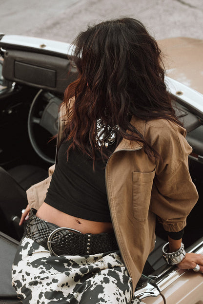Close-up of the Scout Black Braided Belt showcasing the fabric texture and design details.