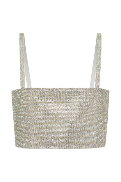 Lifestyle shot of the silver crop top styled for day-to-night versatility.