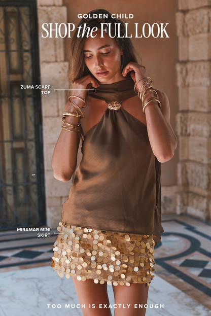 Olive scarf top and gold sequin mini skirt styled as a resort outfit for women.