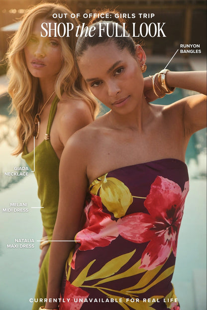 Two women poolside in olive midi dress and tropical floral maxi dress, resort vacation looks.