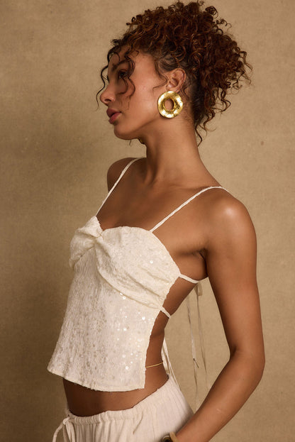 Silvia Ivory Sequin Top paired with complementary accessories for a polished look.