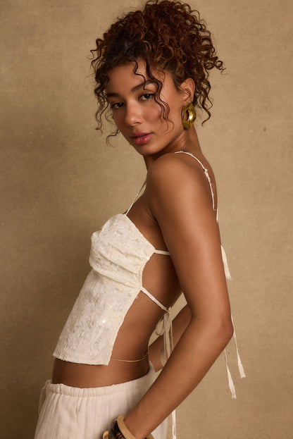 Detail shot of the Silvia Ivory Sequin Top highlighting the sequin elements.