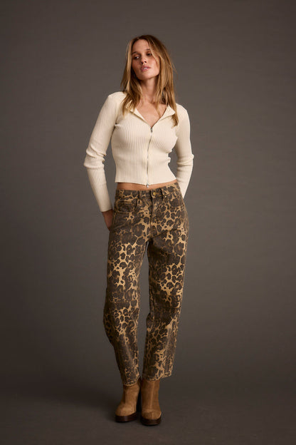 Close-up of the Skye Ivory Zip Up Top showcasing the fabric texture and design details.