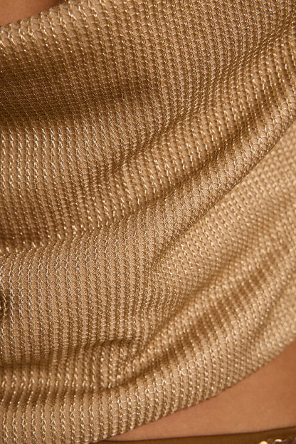 Close-up of the Solene halter top's shimmering gold lurex knit and draped cowl neckline.