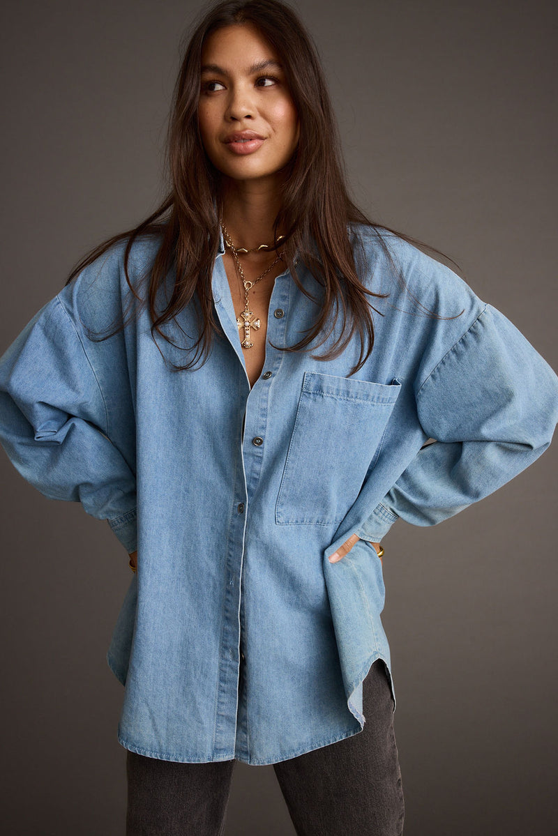 Full-length view of the shirt showing the drape and movement.