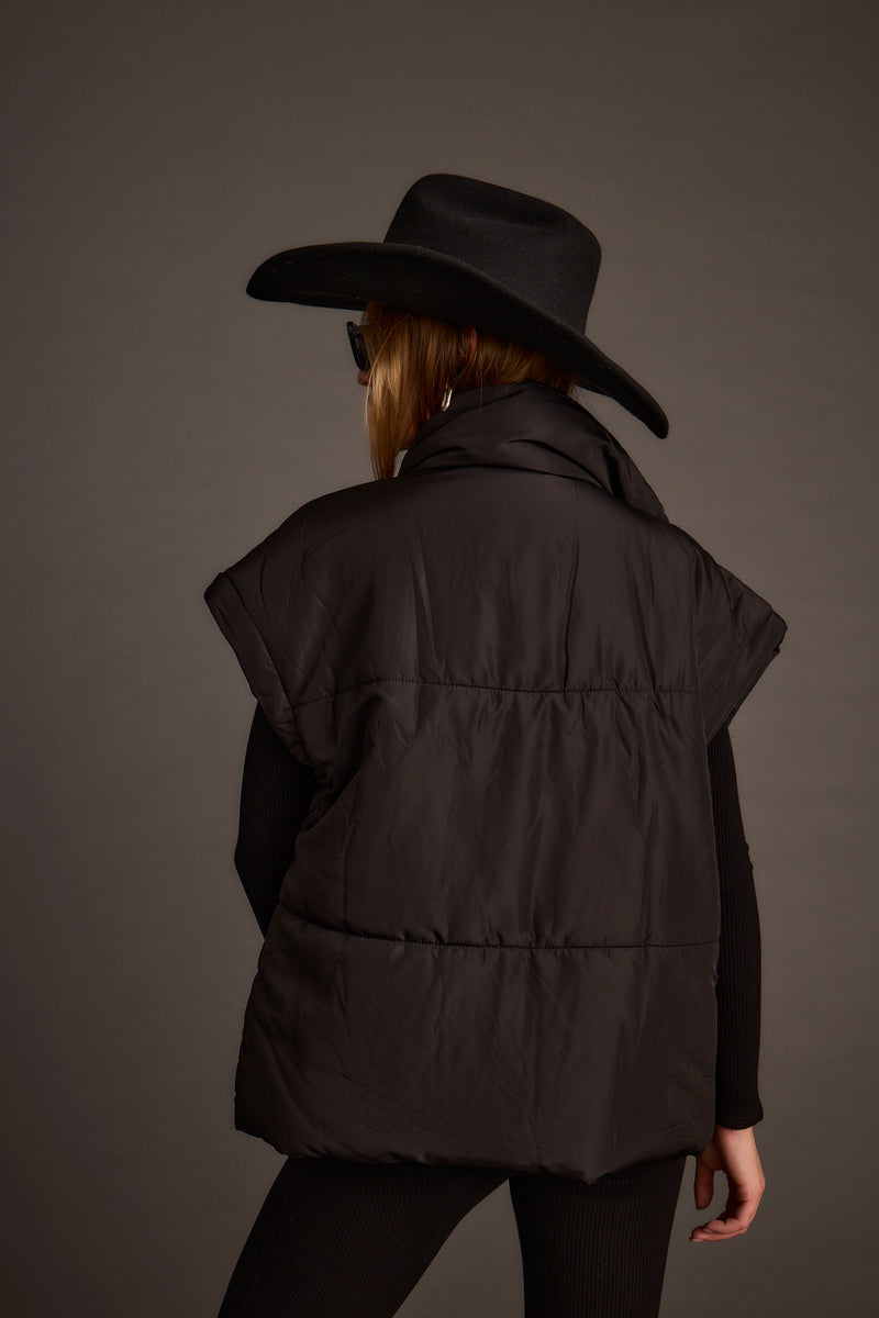 Close-up of the Summit Black Puffer Vest showcasing the fabric texture and design details.