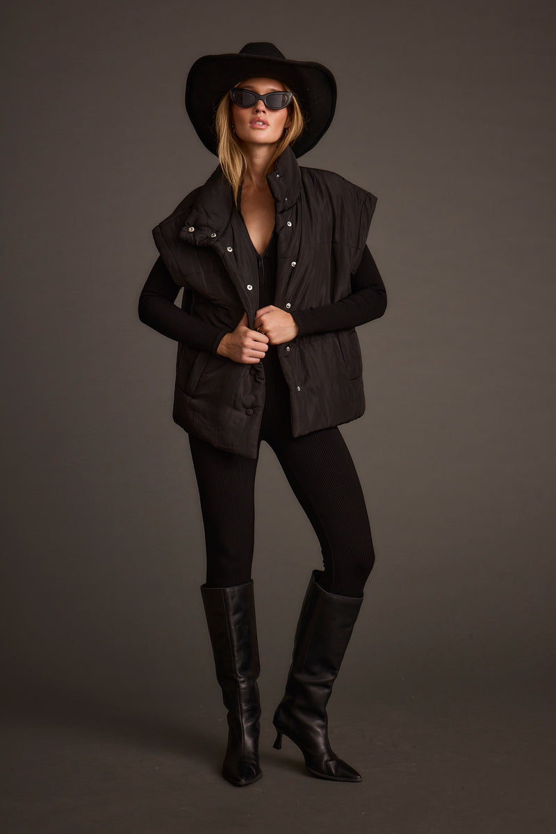 Summit Black Puffer Vest styled in a complete look from an alternate angle.