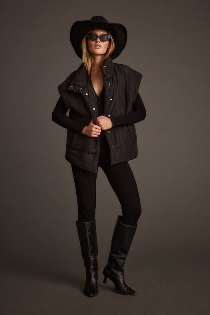 Summit Black Puffer Vest styled in a complete look from an alternate angle.