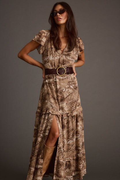 Full-length view of the mocha maxi dress showing the drape and movement.