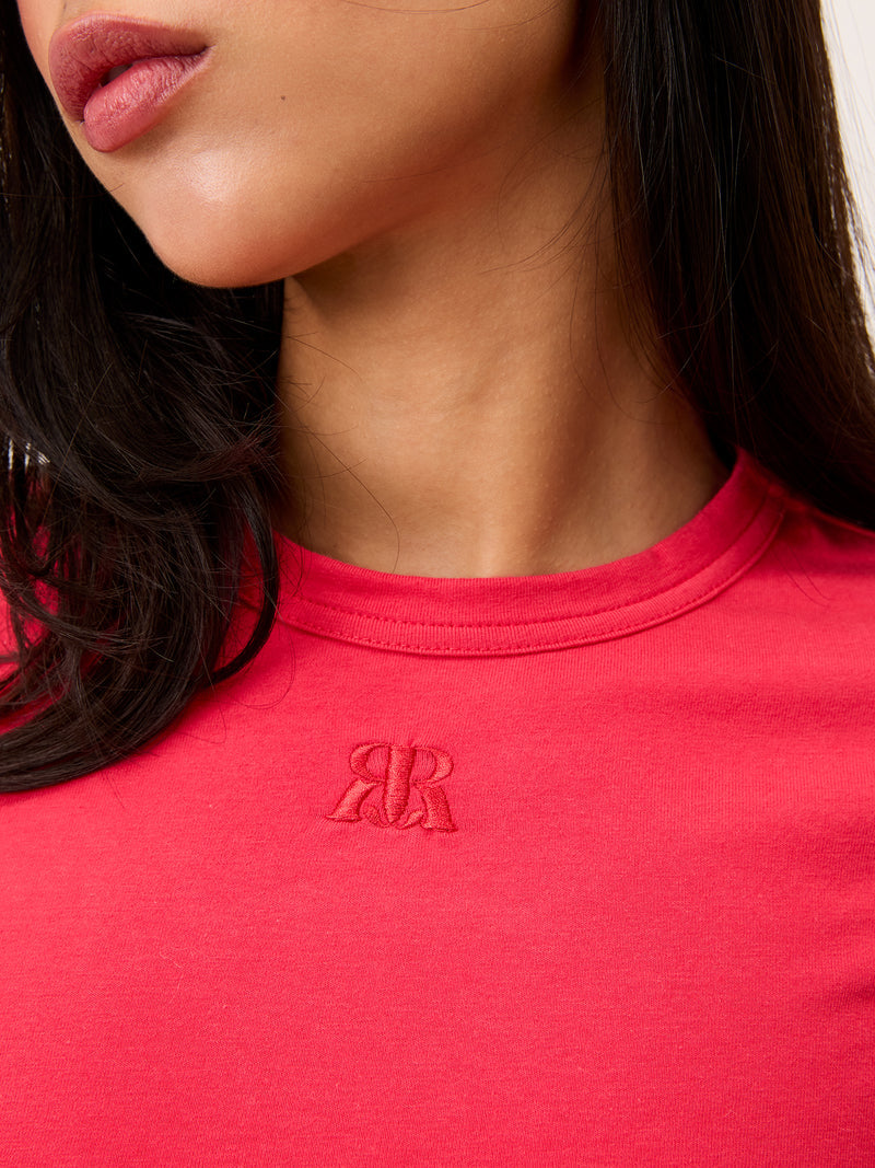 AURELIO red embroidered logo T-shirt worn on a model by Rouje