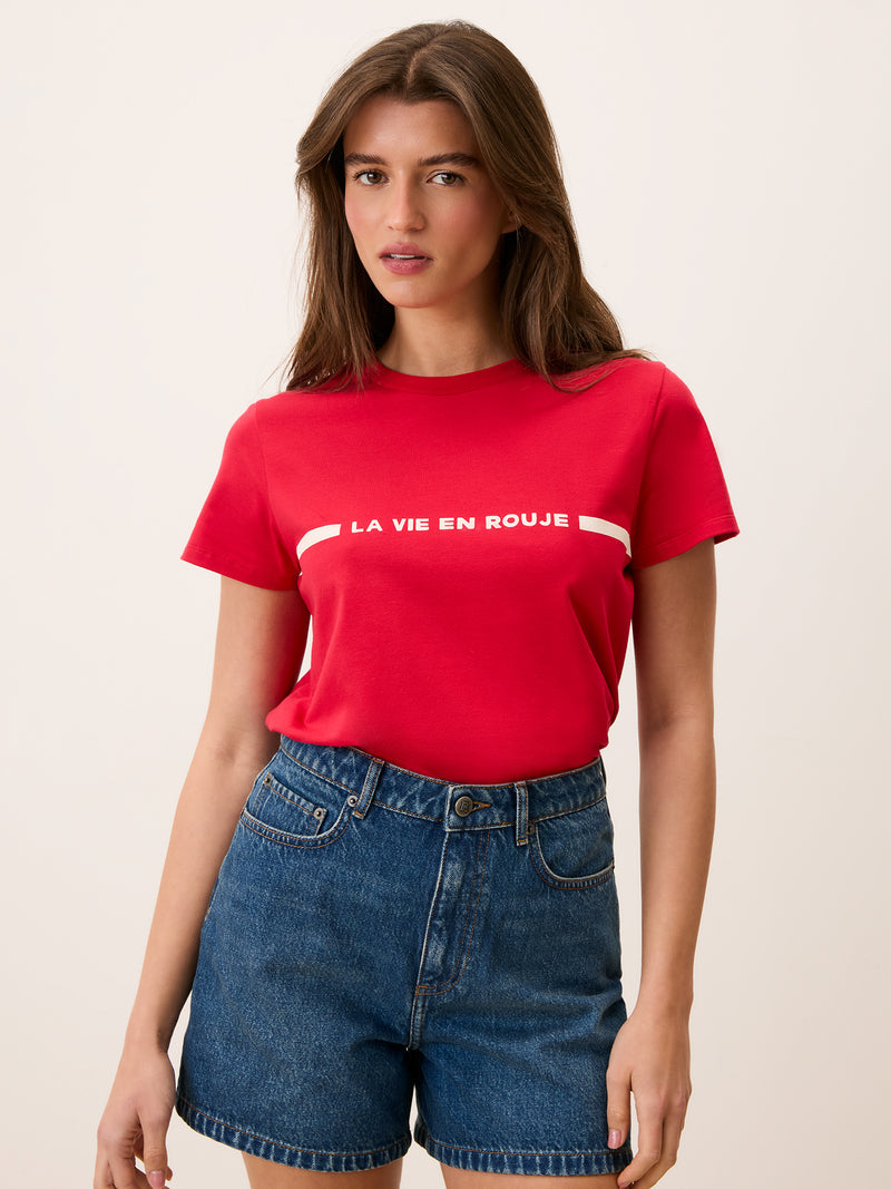 Model wearing the DOLLY red T-shirt by Rouje, straight fit with round collar, made in Portugal