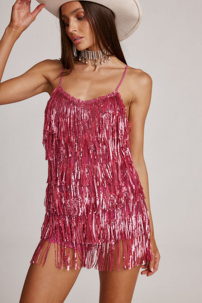 Talia Pink Sequin Fringe Romper paired with complementary accessories for a polished look.