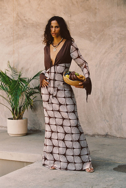 Maxi dress with elegant accents, a vacation maxi dress essential.