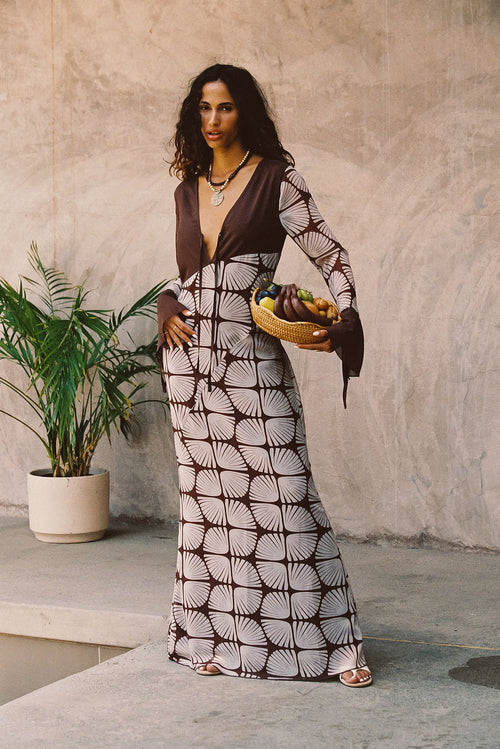 Maxi dress with elegant accents, a vacation maxi dress essential.